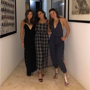 Navy pinstripe jumpsuit with leg slit & low back